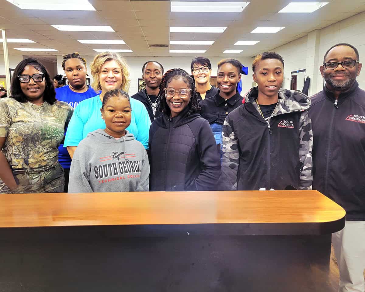 SGTC Barbering instructor Andre Robinson (right) is pictured with female students enrolled in his program.