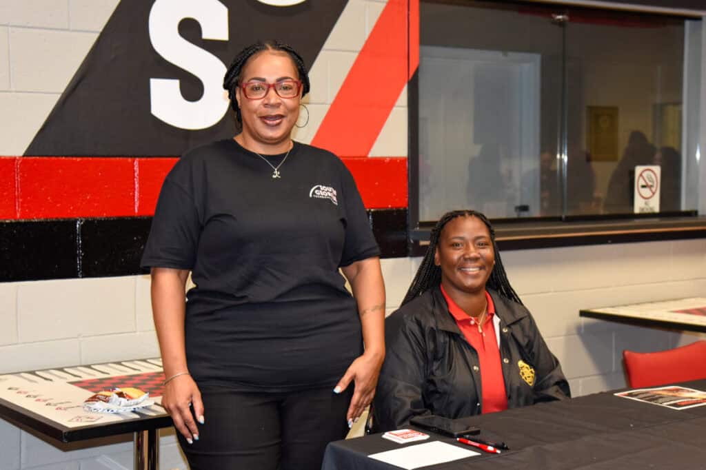 Skilled woman and student at South Georgia Technical College campus, engaging in educational activities.