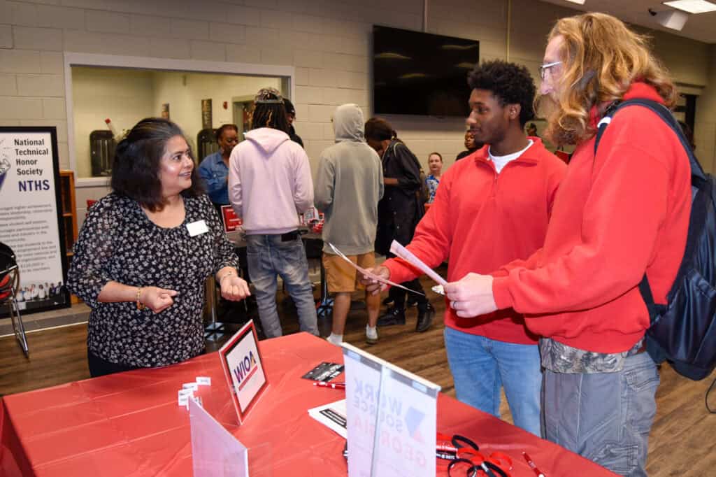 SGTC WIOA Coordinator Sandhya Muljibhai (left) speaks with students at the recent SGTC Resource Fair on the Americus campus.