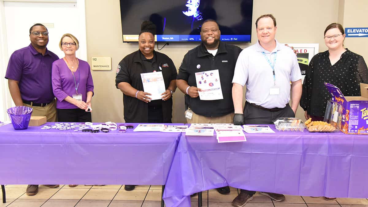 SGTC Assistant Vice President Joshua Curtin (shown 2nd from right) is shown above with SGTC staff members encouraging them to pledge to stop domestic violence in support of National Domestic Violence Awareness Month