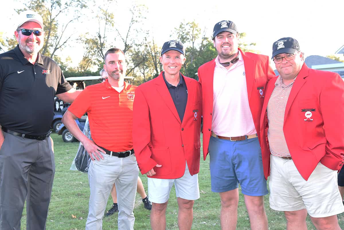 South Georgia Technical College President John Watford (l to r)) and SGTC Athletic Director Jason Carpenter are shown above with the first place Magnolia Manor team of Ty Kinslow, Chandler Studdard and Steven Avant.