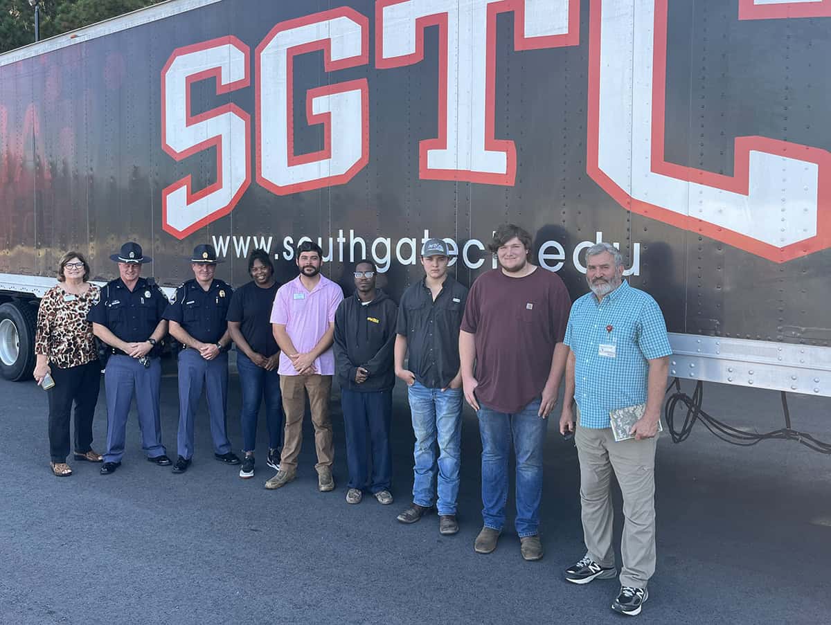 Regional Department of Transportation officers visited the SGTC Commercial Truck Driving class to talk about the responsibilities of driving a commercial vehicle. Shown above with the officers are SGTC personnel and members of the class.