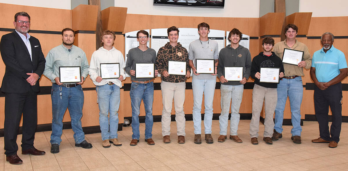 South Georgia Technical College President Dr. John Watford is shown above congratulating the eight Electrical Lineworker students who were presented with the Southeastern Electric Exchange Scholarships recently. They were: Jacob McKinley, Jadyn Tingle, Morgan Fields, Logan Comerford, Bryce Roberts, Jack Cox, Austin Anthony, and Cooper Milner. SGTC Electrical Lineworker Instructor Sydney Johnson is also shown.