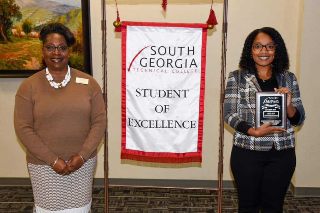Student of Excellence Winner A’Neya Mack (right) with CIS instructor Veronda Cladd.