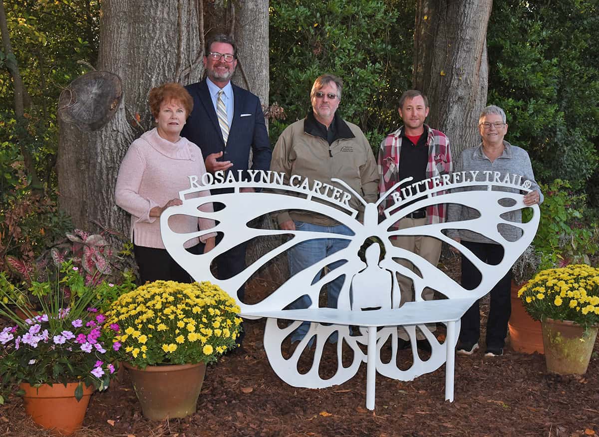 Annette Wise of the Rosalynn Carter Butterfly Trail Board, is shown above with SGTC President Dr. John Watford, SGTC Instructors Tom Mayo and Jeff Sheppard and Mary Parsons of 8 Mile Customs, LLC, who collaborated with the original art design from GSW students to complete the Rosalynn Carter Butterfly Trail bench that now sits off Paschall Street in Plains, Georgia.