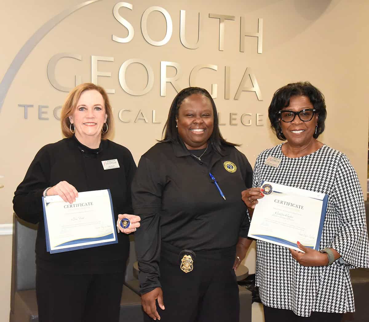 South Georgia Technical College Career Specialist Lisa Truitt (l) and SGTC Director of Career Services (r) are shown above with Assistant Chief Community Supervision Officer Terra Taylor-Cochran from the Georgia Department of Community Supervision Southwestern Judicial Circuit District #3, who presented the two SGTC officials with certificates of appreciation and a special challenge coin for their work on the Community Resource Fair held at SGTC recently.