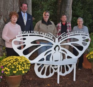 Annette Wise of the Rosalynn Carter Butterfly Trail Board, is shown above with SGTC President Dr. John Watford, SGTC Instructors Tom Mayo and Jeff Sheppard and Mary Parsons of 8 Mile Customs, LLC, who collaborated with the original art design from GSW students to complete the Rosalynn Carter Butterfly Trail bench that now sits off Paschall Street in Plains, Georgia.
