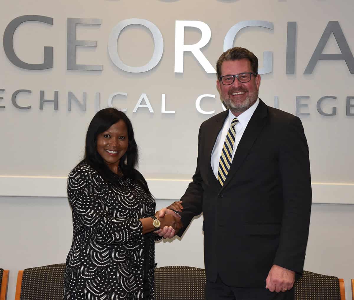 State Representative Patty Stinson is shown above talking with SGTC President Dr. John Watford