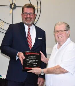 South Georgia Technical College President Dr. John Watford is shown above presenting a token of appreciation from the college to SGTC Alumnus of the Year Charles Jenkins for his outstanding achievements in the field of practical nursing.