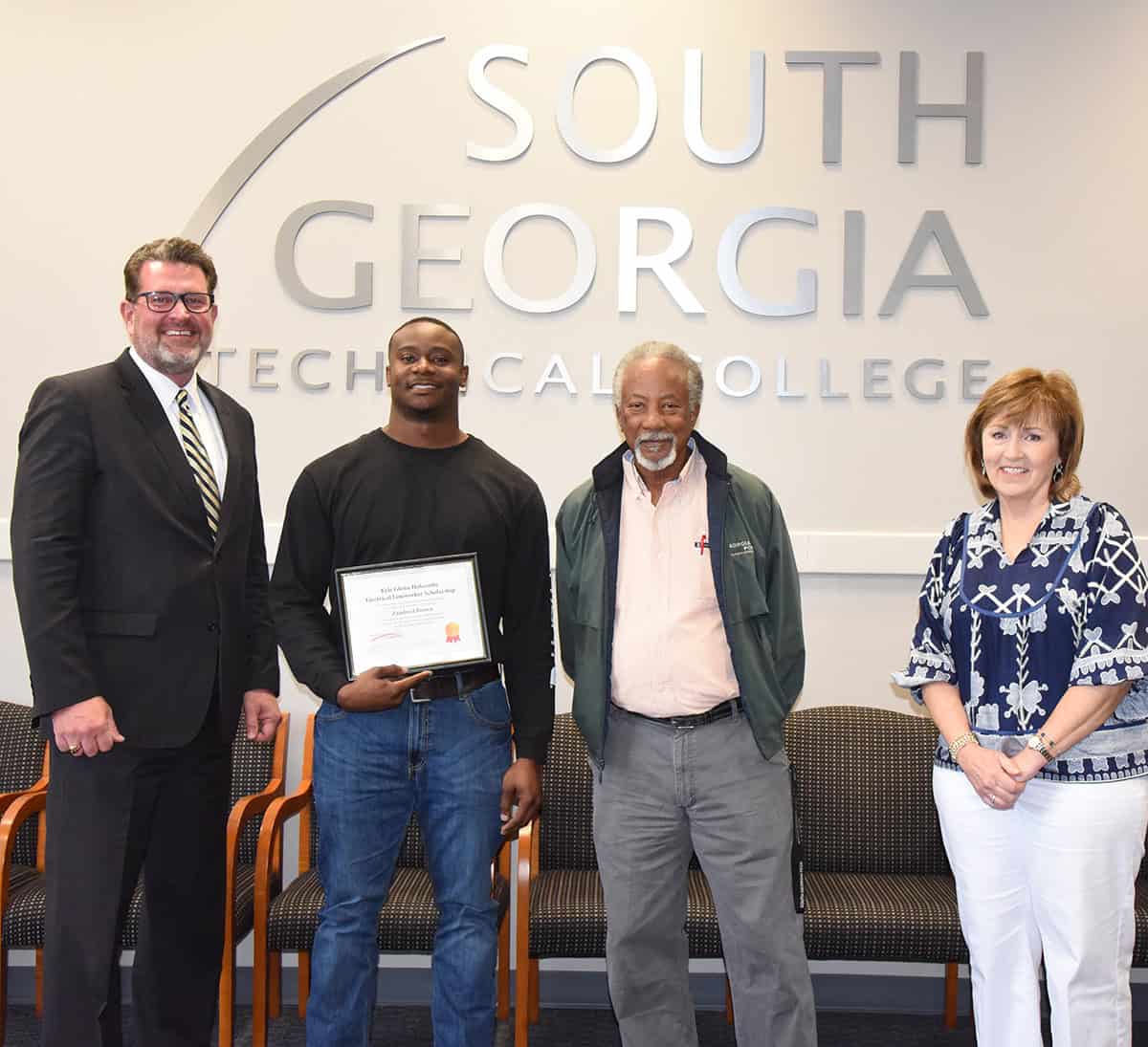 South Georgia Technical College President Dr. John Watford is shown above congratulating Electrical Lineworker student Zandreel Brown on receiving the Kyle Glenn Holcombe Scholarship. Also shown with Dr. Watford and Brown are SGTC Electrical Lineworker Instructor Sydney Johnson and SGTC Economic Development Assistant and Partnership Coordinator Tami Blount.