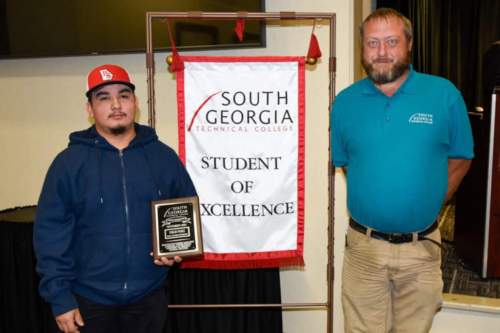 SGTC Student of Excellence winner Sergio Perez (left) with Diesel Equipment Technology instructor Chase Shannon.