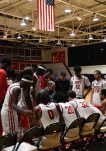 The Jets talk strategy with head coach Chris Ballauer while fighting to come back against Chipola.