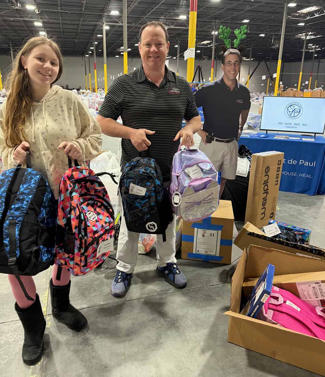 SGTC Assistant Vice President of Student Affairs Josh Curtin and his daughter Seraphina deliver donations to Clark’s Christmas Kids in Atlanta.