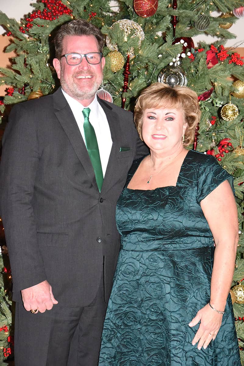 South Georgia Technical College President Dr. John Watford and his wife, Barbara, are shown above by one of the many Christmas trees decorating the John M. Pope Center.