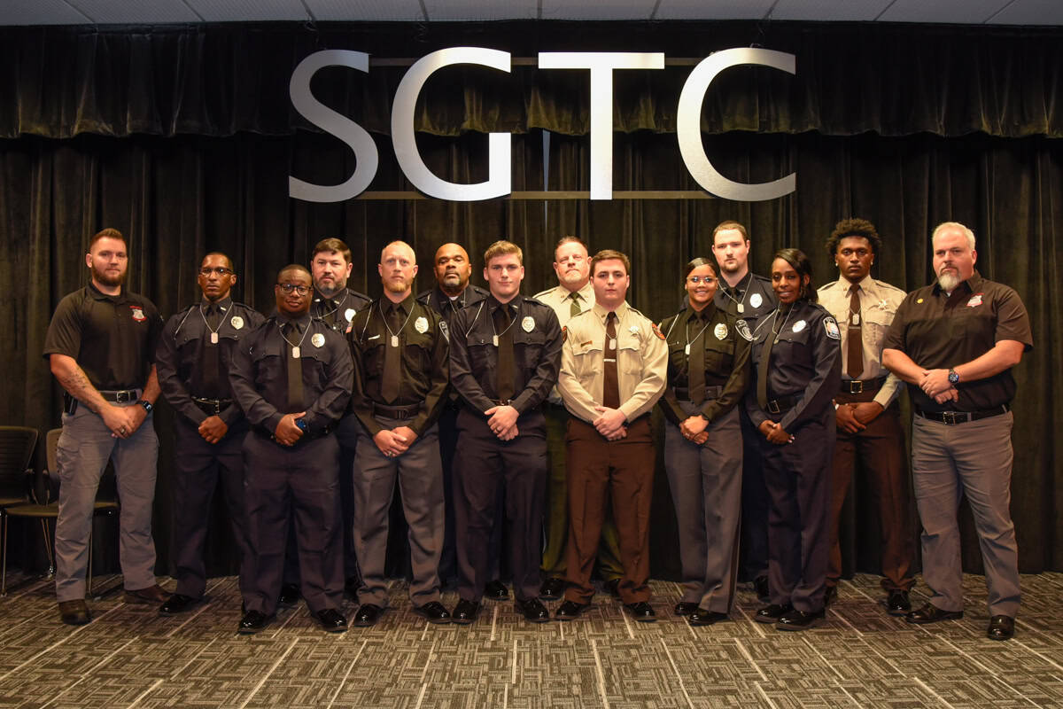 Pictured are members of the SGTC Law Enforcement Academy Class 25-01 with instructor Joshua Blake (left) and Academy Director Jim Mitchell (right) at the recent graduation ceremony.
