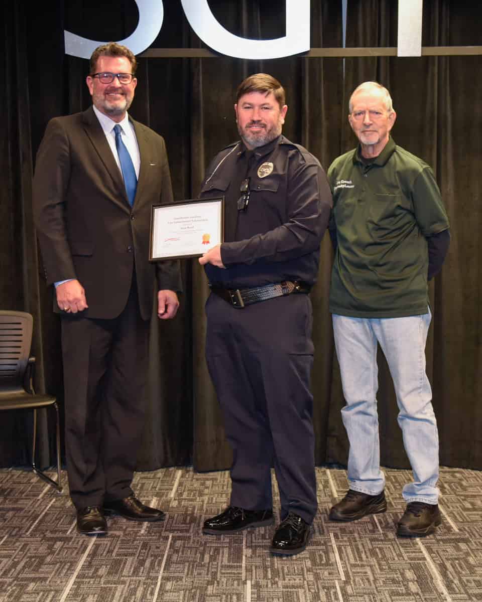 South Georgia Technical College President Dr. John Watford (l) is shown above with Lou Crouch presenting the Smallwood – Sondron Scholarship award to Sean Reed (c).
