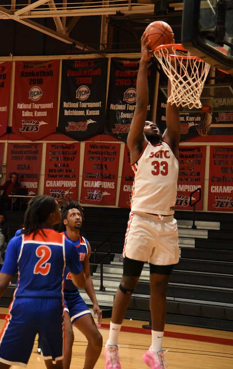 Matt Mbole, 33, is shown above dunking the ball during the match-up with Georgia Highlands. He had a double-double night with 19 points and 18 rebounds.
