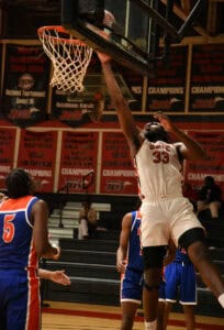 Matt Mbole, 33, is shown above dunking the ball during the match-up with Georgia Highlands. He had a double-double night with 19 points and 18 rebounds.