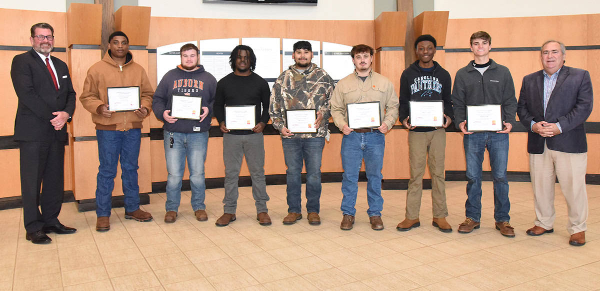 South Georgia Technical College President Dr. John Watford (left) is shown above congratulating the Electrical Lineworker students who were presented with the Southeastern Electric Exchange Scholarships recently. They were: Landon Brown of Wrens, Zackery Neal of Woodbury, Kanard Wynn of Savannah, Jim Galvin of Morris, Bo Miller of Valdosta, Darryl Cuyler of Wadley, and Aston Cook of Lakeland, Ga. Also shown with the class is SGTC Business and Industry Director for the Americus campus, Paul Farr.