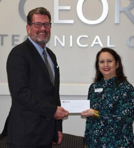 South Georgia Technical College President Dr. John Watford, (l), is shown above accepting a donation for the SGTC Foundation from Marian McLemore, (r) Vice President of Cooperative Communications with Flint Energies.