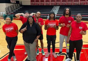 SGTC Vice President of Student Affairs Eulish Kinchens is shown above with her winning Studen Affairs Jets which claimed the SGTC Intramural Basketball Tournament Championship in a rematch against Police Chief Calvin Hodge and the Campus Safety Jets.
