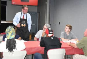 SGTC President Dr. John Watford (standing) is shown above talking with the Crisp County Center students at the “Pancakes with the President” event.