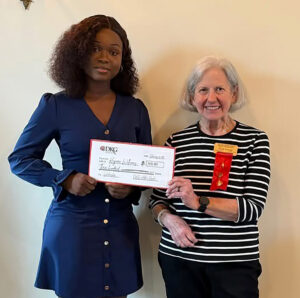 Delta Kappa Gamma member Fran George (r) is shown above presenting a scholarship check to SGTC Keyara Williams (i).