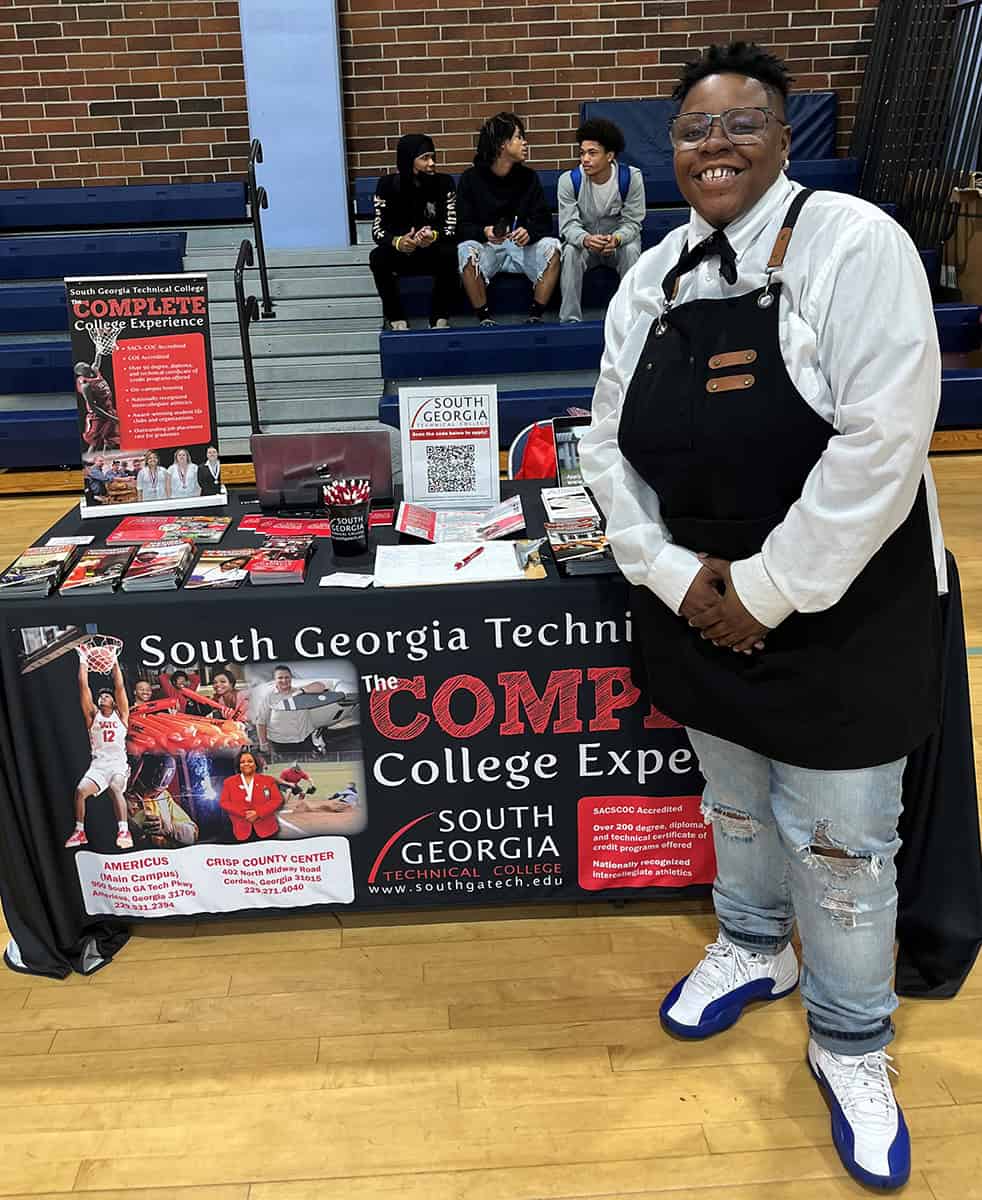 Zandreal Blakey is shown above at the SGTC recruiting table that was set up at the Benjamin E. Mays High School Brotherhood Summit recently.