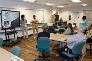 SGTC Marketing Management students Christian Thompson (left) and Qwantavis Milledge present the results of a class project on the Americus campus.