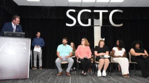 SGTC President Dr. John Watford is shown talking with the new NTHS members.